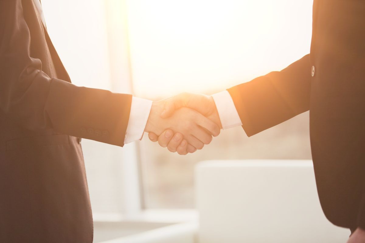 close up.handshake of business partners on blurred background.
